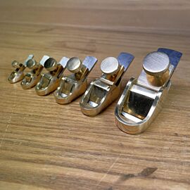 Round sole brass finger planes